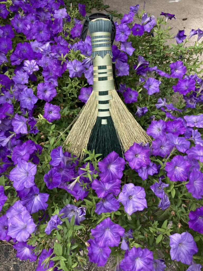 whisked away flower and brooms
